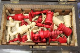 Early 20th century ivory chess pieces contained in an old box