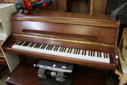 A Bentley upright piano and a piano seat