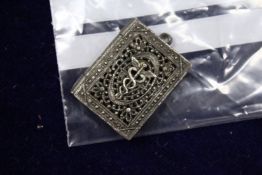 A small filigree pendant