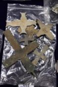 A large Roman bronze cross and similar smaller crosses