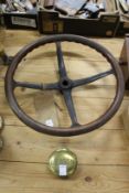 An early steering wheel and a brass wheel nut (?)