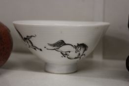A small Chinese bowl painted with horses