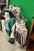 Two sets of golf clubs