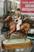 Royal Worcester model of HRH the Duke of Edingburgh mounted on a horse playing polo