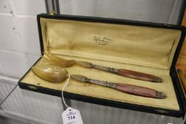 A pair of French salad servers with decorative handles, boxed