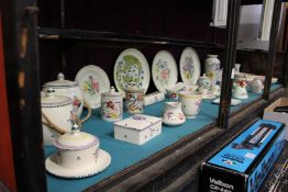 A good collection of Poole pottery china to include plates vases bowls biscuit barrels lamps etc