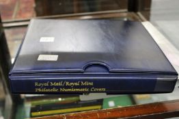 A Royal Mail/Royal Mint Philatelic Numismatic covers complete with slip case