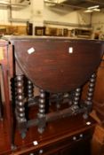 An oak drop leaf gateleg table