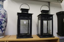 A pair of large candle lanterns