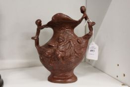 A small painted metal vase