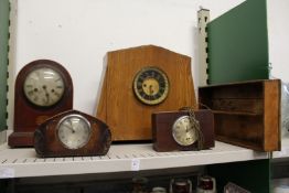 Various clocks and a cutlery tray