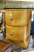 A pair of Art Deco style bow fronted two drawers bedside chests