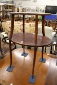 A mahogany oval two tier etagere