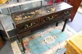A Chinese chinoiserie decorated three drawer side table on stand