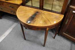 A George III mahogany demi lune fold over card table (top af)