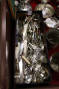 A box containing silver and plated flatware serviette rings etc