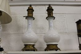 A pair of opaque glass table lamps
