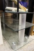 A glass three tier tv stand