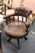 A Victorian mahogany framed and leather upholstered swivel office desk chair