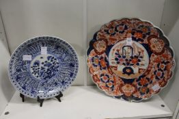 An Imari wavy edged charger and a blue and white dish