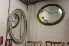 Two oval mirrors