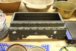 A heavy cast bronze clock base