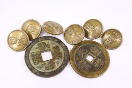 Chinese coins or tokens and six bronze Chinese buttons