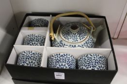 A Japanese porcelain saki set, boxed