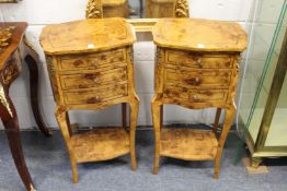A pair of burr wood three drawer bedside chests on cabriole legs with an undertier