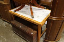 A tile topped pine kitchen table