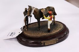 Miniature model of horse and jockey (after the race)