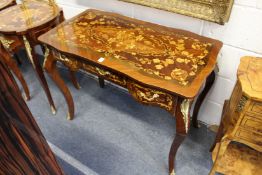 A French style inlaid and ormolu mounted three drawer side table or desk