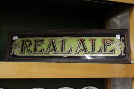 A pub sign 'Real Ale'
