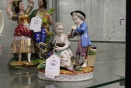 An 19th century Meissen style porcelain group of a boy and girl