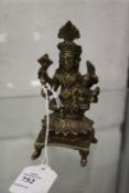 A small Eastern bronze seated deity