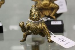 A small bronze figure of baby krishna