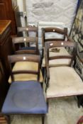 A pair of regency mahogany carver chairs and three matching side chairs
