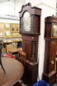 A large 19th century mahogany longcase clock with painted arched dial signed R Hughes