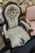 A Victorian mahogany framed spoon back armchair