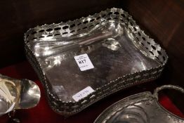 A Continental silver dish with decorative sides