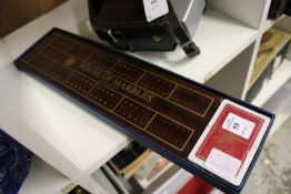A cribbage board and cards