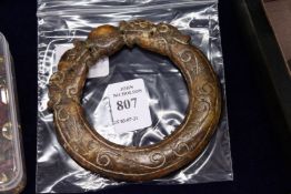 A Chinese carved hardstone amulet