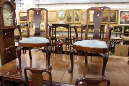 A set of eight George II style mahogany dining chairs, two with arms all with with vase shaped