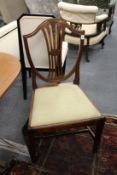 A set of four hepplewhite style mahogany shield back dining chairs