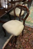 A set of six mahogany balloon back dining chairs