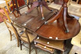 A reproduction mahogany twin pedestal dining table