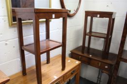 A pair of Chinese hardwood two tier stands