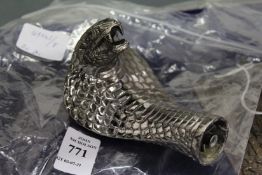 A cobras head walking stick handle