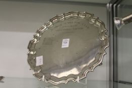 An engraved silver salver