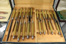 A boxed set of horn handled knives possibly rhino